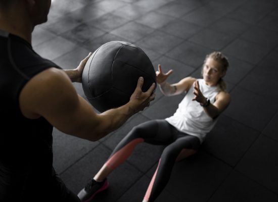 close-up-people-training-with-ball